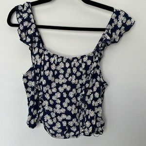 Blue ruffle crop top with daisies